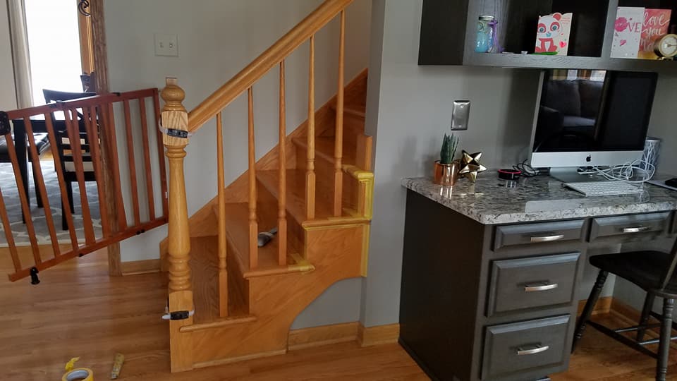 Dr. Paint Inc. Before: Cabinet Painting Ocala FL - Dark wooden desk before Professional Painting Services